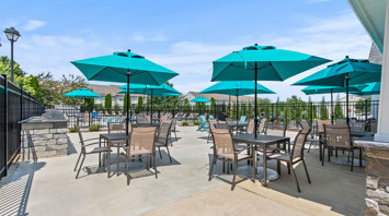 The View at Mackenzi Garden apartments with outdoor pool and lounge seating in York, PA – The View at Mackenzi