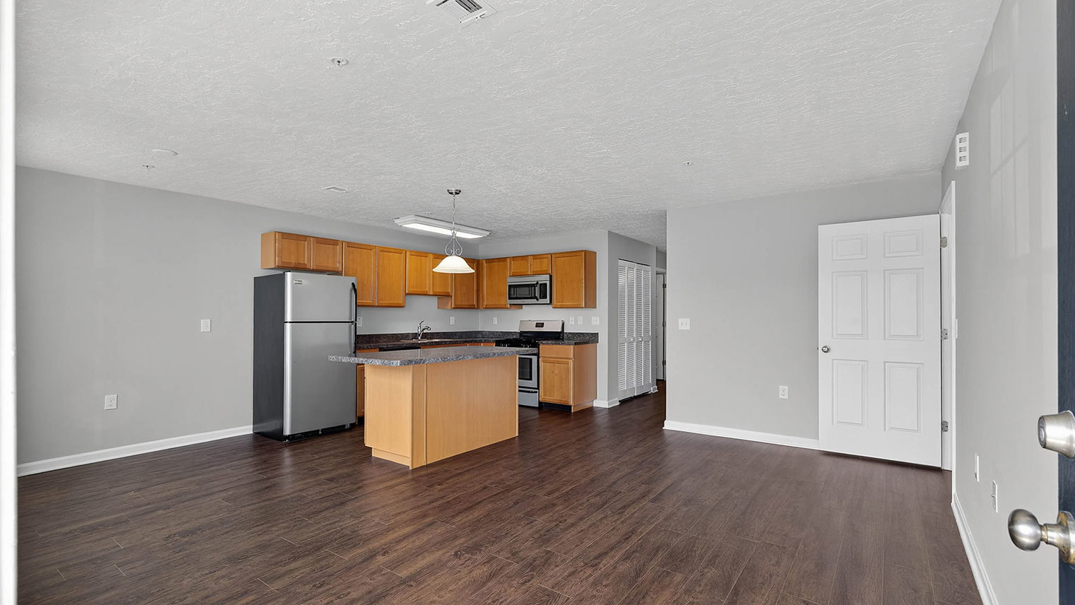 The View at Mackenzi Garden apartment kitchen, dining, and living room in York, PA – The View at Mackenzi