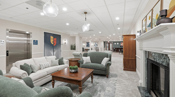 Horizons at the Village at Whitehall Community center with fireplace and entrance to theater room – Horizons at the Village at Whitehall | 55+ Community in Lehigh County, PA