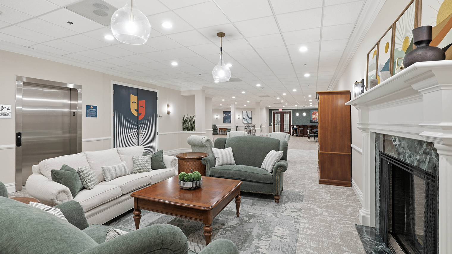Horizons at the Village at Whitehall Community center with fireplace and entrance to theater room – Horizons at the Village at Whitehall | 55+ Community in Lehigh County, PA