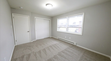 Geraldine Street Apartments Affordable pet-friendly apartment rental primary bedroom with windows and closet in Bethlehem, PA – Geraldine Street Apartments