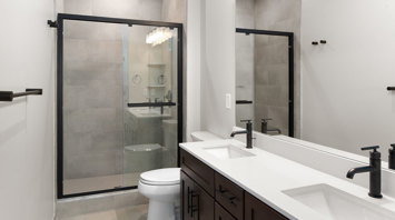 Monte View at Pohatcong Luxury garden apartment primary bathroom with double vanity and walk-in shower in Pohatcong Twp, NJ – Monte View at Pohatcong