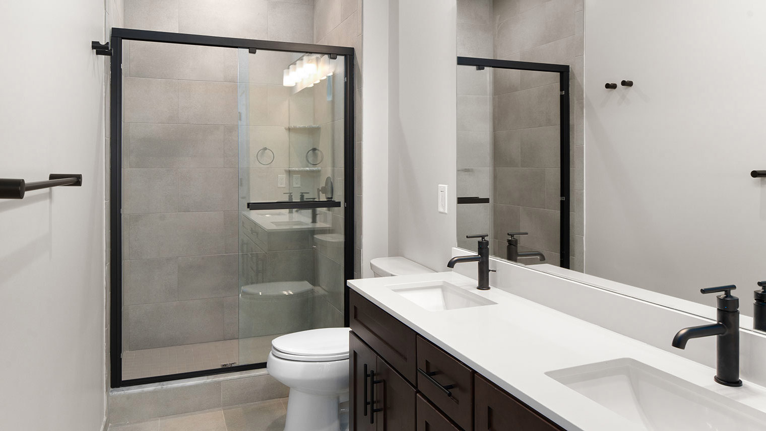 Monte View at Pohatcong Luxury garden apartment primary bathroom with double vanity and walk-in shower in Pohatcong Twp, NJ – Monte View at Pohatcong