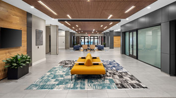 3 West Newly renovated lobby featuring modern seating and an open staircase in two-story building, offering built-to-suit retail and office space for lease in Downtown Bethlehem, PA – 3 West