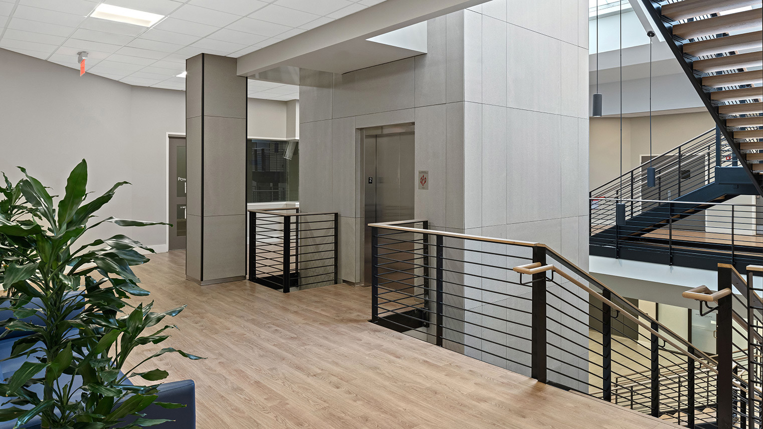 3 West Newly renovated lobby featuring a passenger elevator, open staircase and wood-style flooring in two-story building with retail and office space for lease in Downtown Bethlehem, PA – 3 West