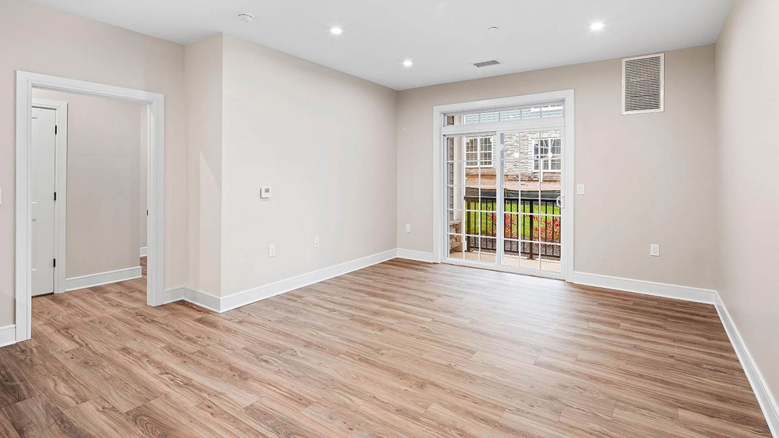 The Ridge at Readington Pet friendly apartment living room and patio/balcony in Whitehouse Station, NJ – The Ridge at Readington