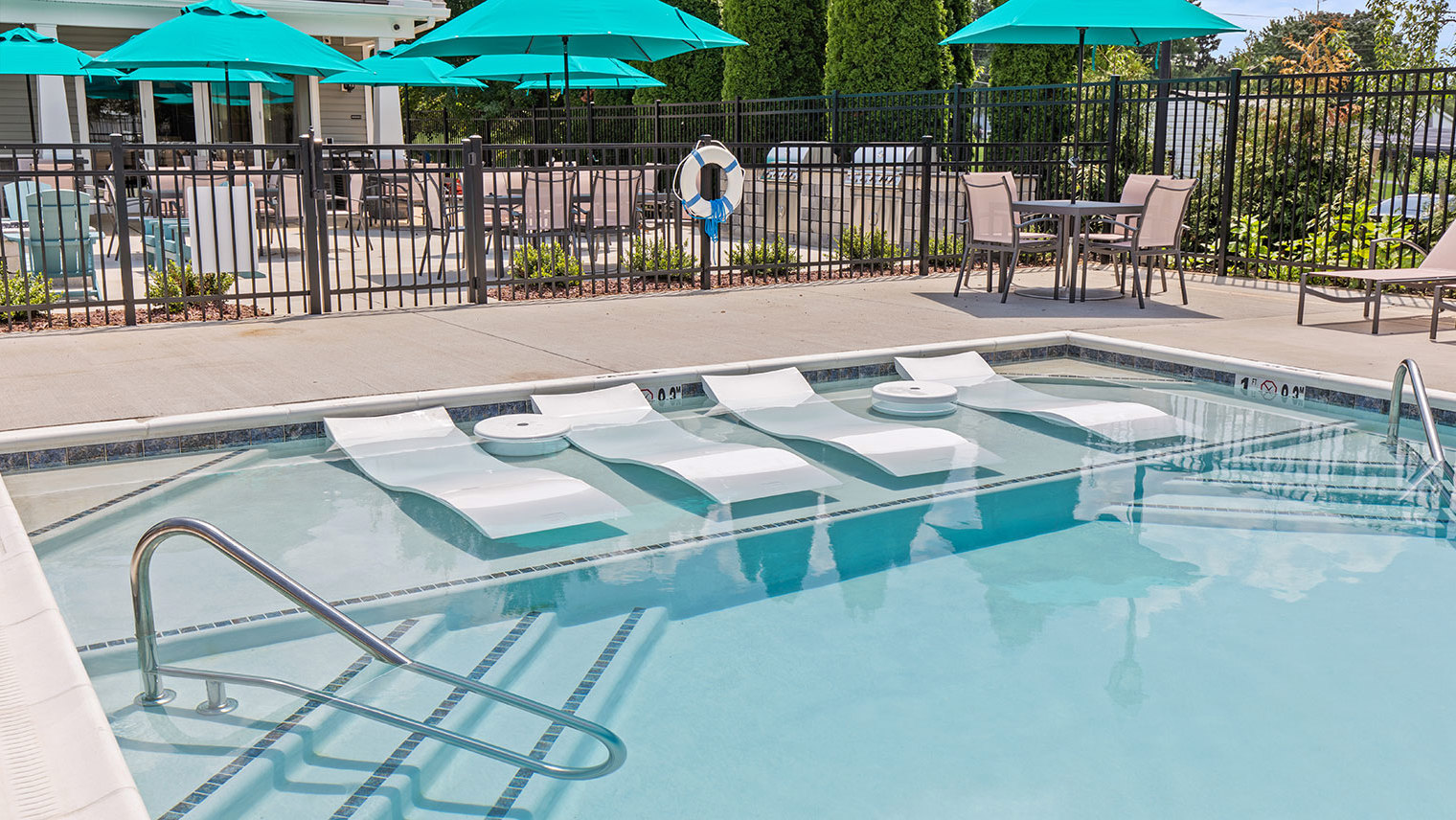 The View at Mackenzi Garden apartments with outdoor pool and tanning ledge in York, PA – The View at Mackenzi