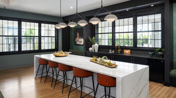 Trailside Village modern clubhouse kitchen with island seating – Trailside Village luxury apartments for rent in Easton, PA