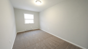 Geraldine Street Apartments Affordable pet-friendly apartment rental second bedroom with window in Bethlehem, PA – Geraldine Street Apartments