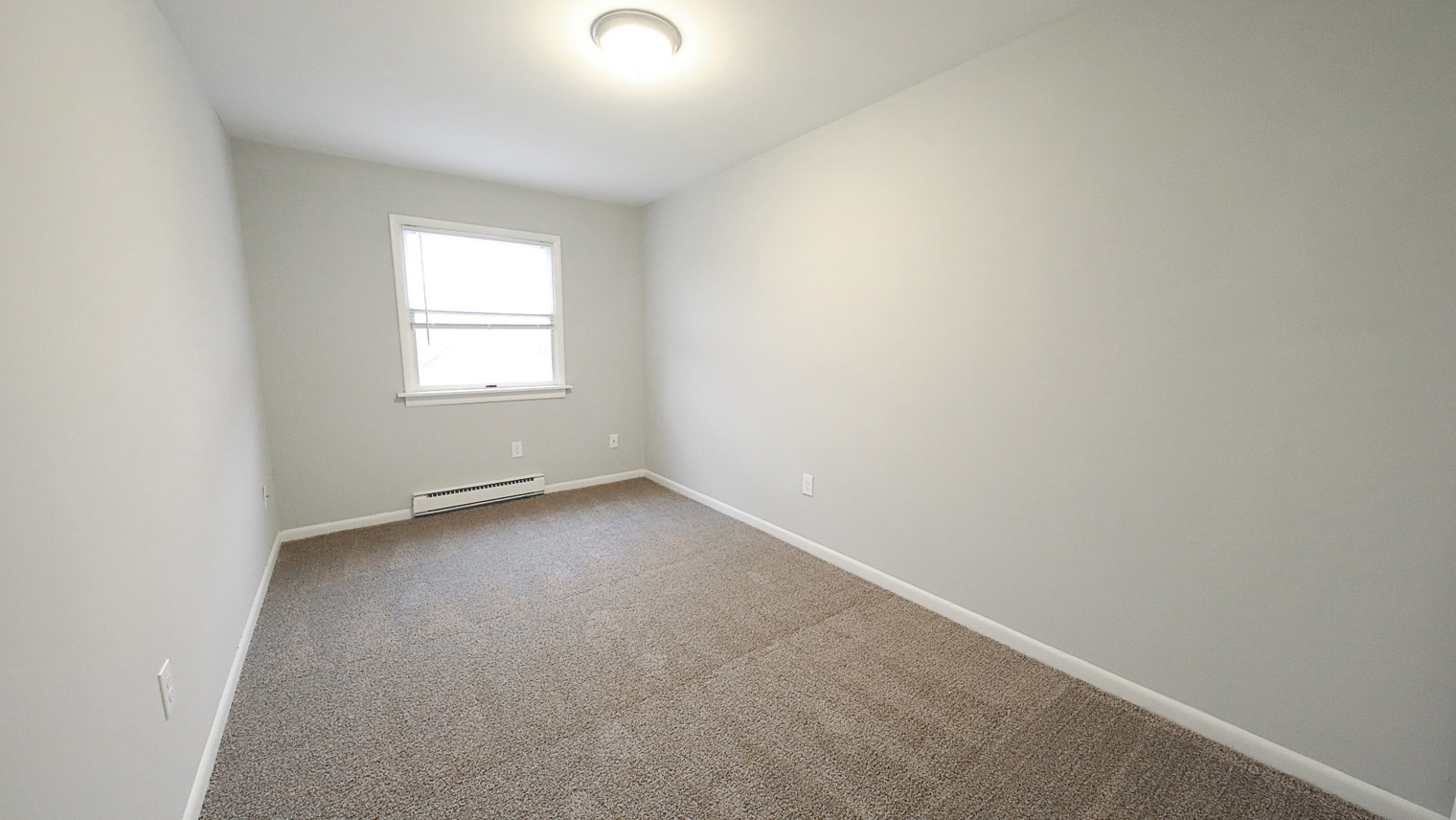 Geraldine Street Apartments Affordable pet-friendly apartment rental second bedroom with window in Bethlehem, PA – Geraldine Street Apartments
