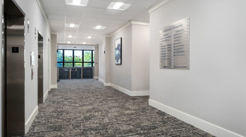 Raritan Commons First-floor hallway with office suite available for lease at Raritan Commons in Flemington, NJ