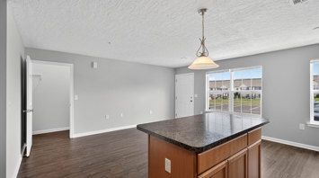 The View at Mackenzi Garden apartment living room and kitchen island in York, PA – The View at Mackenzi