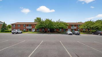 The Meadows at Lehigh Exterior view of pet-friendly 3-bedroom townhomes and 1-2 bedroom apartments with parking in Bethlehem, PA – Meadows at Lehigh