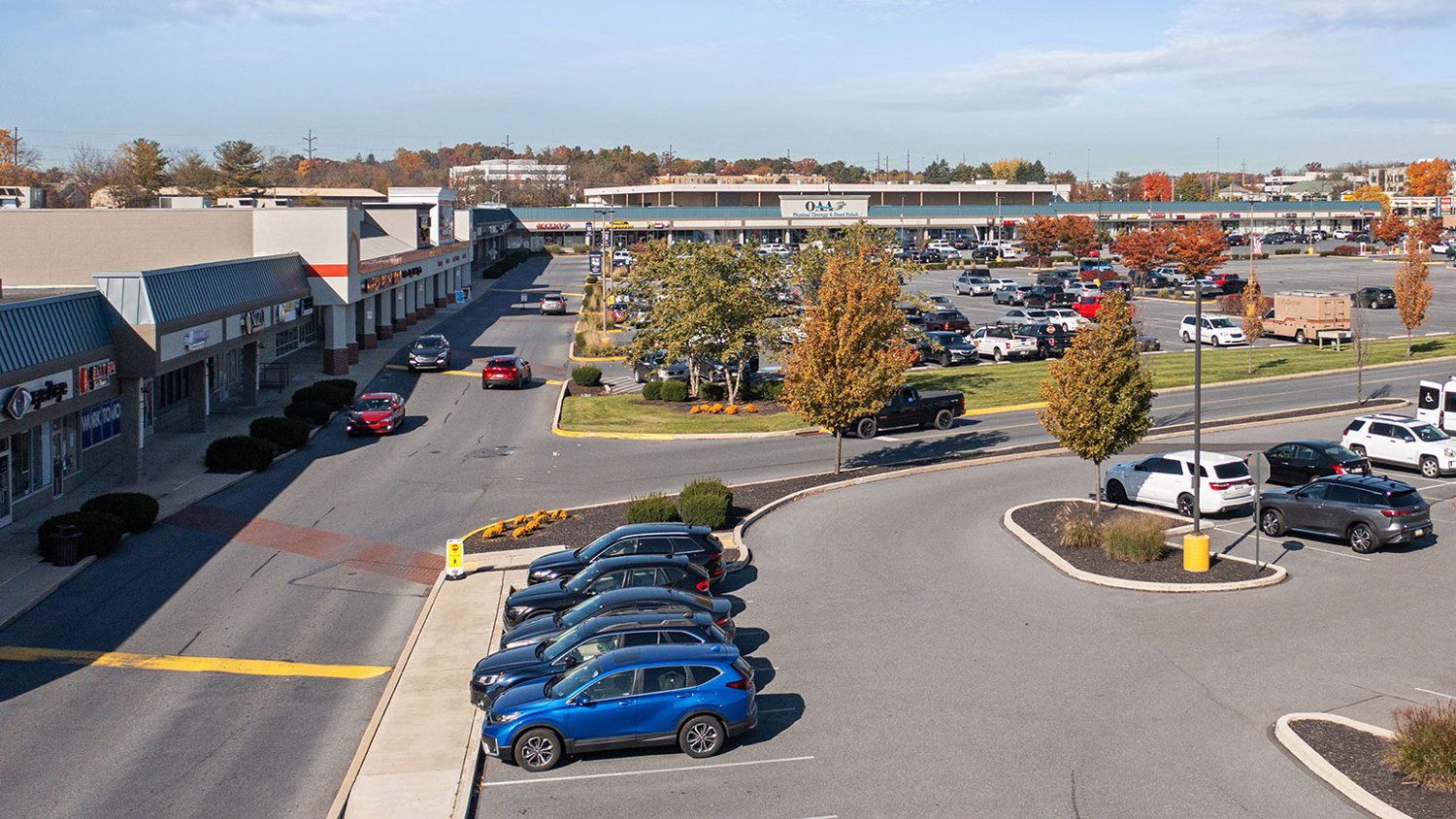 Parking lot in commercial shopping center offering retail, medical, office and restaurant space for lease in South Whitehall, PA – Tilghman Square Shopping Center