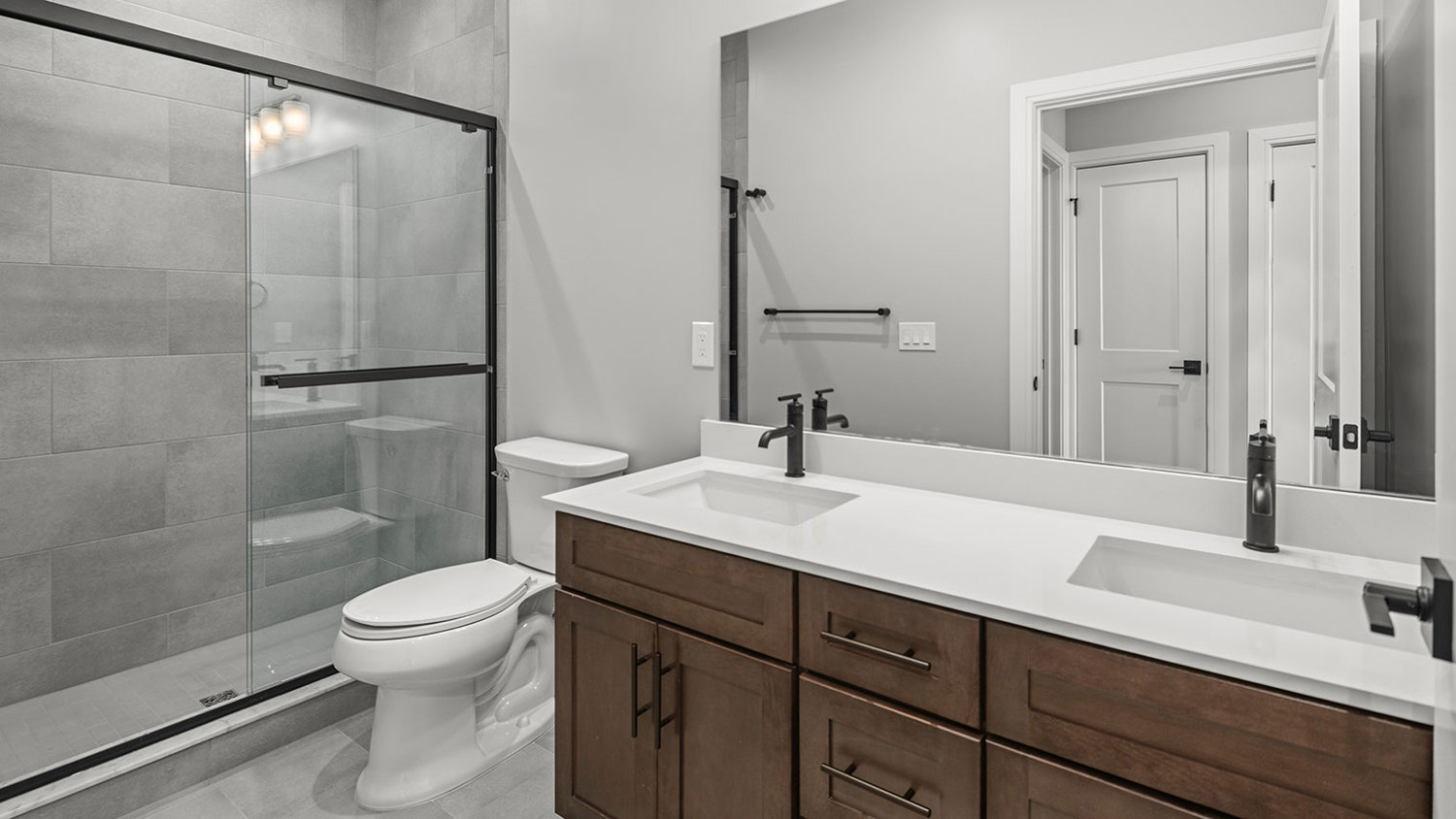 Luxury elevator building apartment primary bathroom with walk-in shower in Pohatcong Twp, NJ – Monte View at Pohatcong
